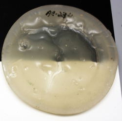 The raw resin AC234 in a thick pour in 1987, photographed in 2010. The crazed appearance is typical of shrinkage during initial drying.