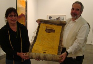 Barbara and Mark Golden receive a commemorative scroll from employees at a GOLDEN ESOP Majority Ownership Celebration.