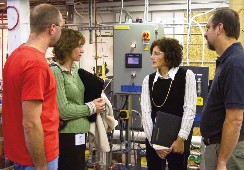 Left to right: GOLDEN Resource Management Technician Tim Knapp; Commerce Chenango President and CEO Maureen Carpenter; Linda Jacobs, with the Environmental Services Unit of Empire State Development and GOLDEN Facility Engineer Fran Reale discuss the benefits of the new Reverse Osmosis System.