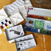 Painting on Location with QoR Modern Watercolors Various watercolor palettes.