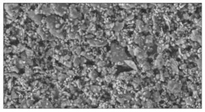 Image 4: Scanning Electron Micrograph of paint film above CPVC, with pigment volume ratio of 60%. Gloss And Surface Structure Through A Paint PVC Ladder, N J Elton, A Legrix. © 2008, Suroptic Ltd.